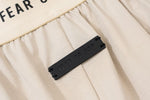 Load image into Gallery viewer, Pronta Entrega - Shorts Fear Of God Essentials Beje
